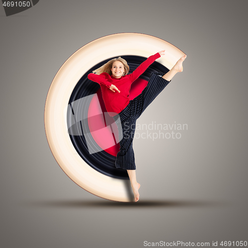 Image of female dancer in action with circular motion background