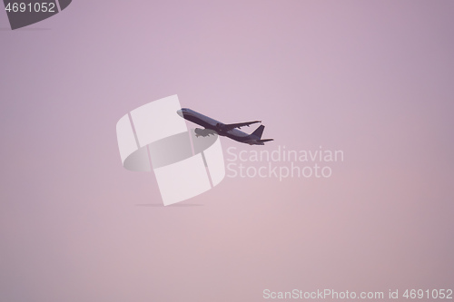 Image of plane sunset haze