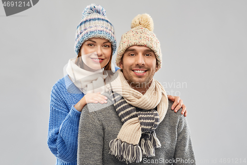 Image of happy couple in winter clothes