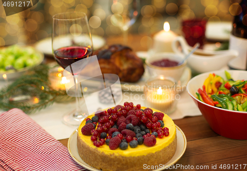 Image of cake and other food on christmas table at home