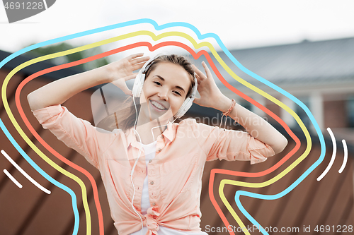 Image of happy teenage girl with headphones in city