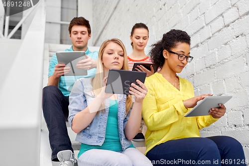 Image of high school students with tablet computers