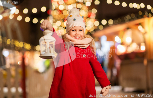 Image of happy little girl at christmas with lantern market