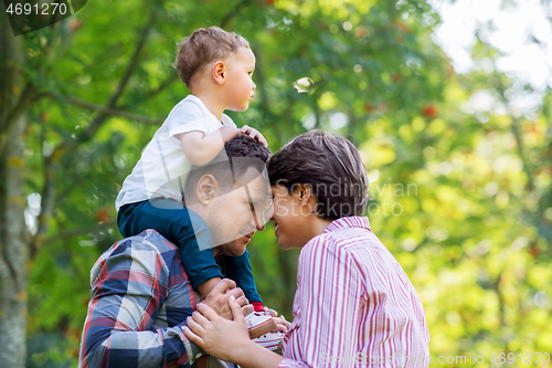 Image of happy family at summer park