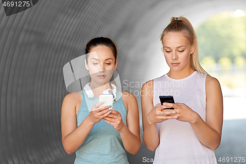 Image of women or female friends with smartphones