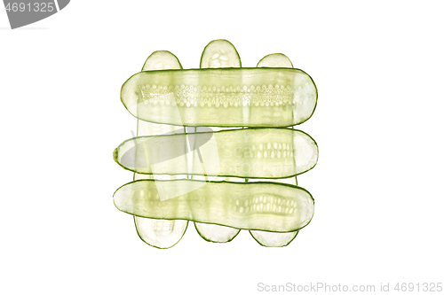 Image of Square pattern from thin transparent slices of natural organic cucumber.