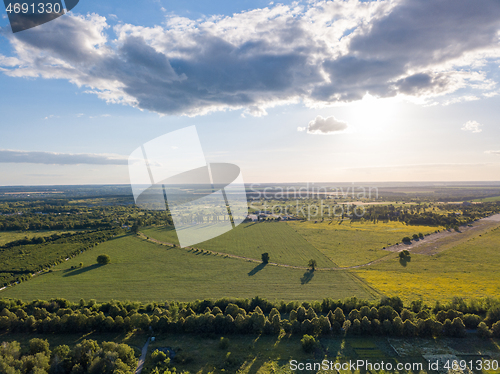 Image of Panoramic aerial view from a drone above the countryside area on a sunny cloudy day.