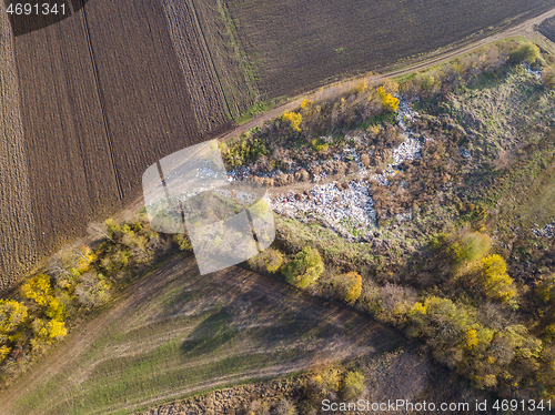 Image of Bird-eye view from drone above landfill site from a garbage pile.