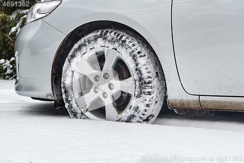 Image of Car tyre in snow