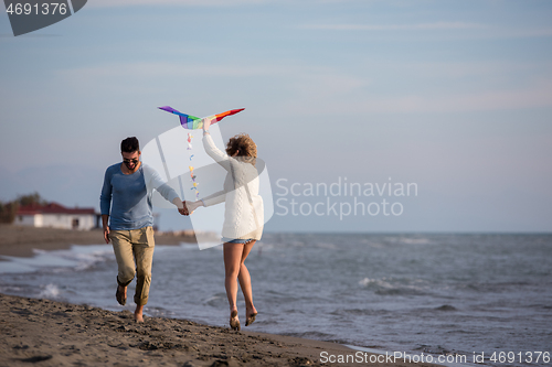 Image of Couple enjoying time together at beach