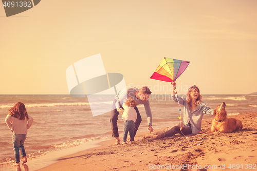 Image of happy young family enjoying vecation during autumn day