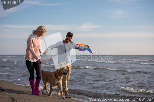 Image of happy couple enjoying time together at beach