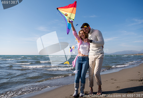 Image of Couple enjoying time together at beach