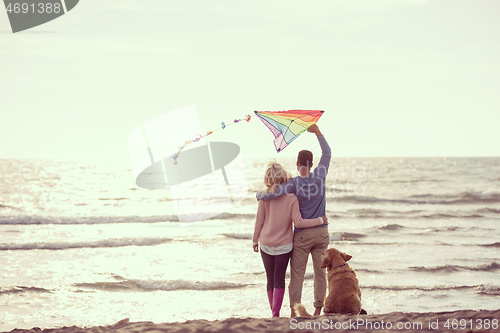 Image of happy couple enjoying time together at beach