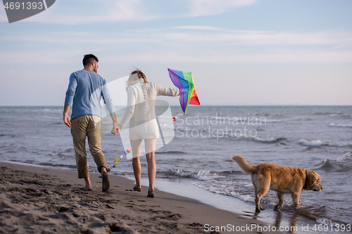 Image of happy couple enjoying time together at beach