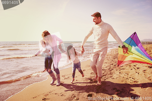 Image of happy family enjoying vecation during autumn day