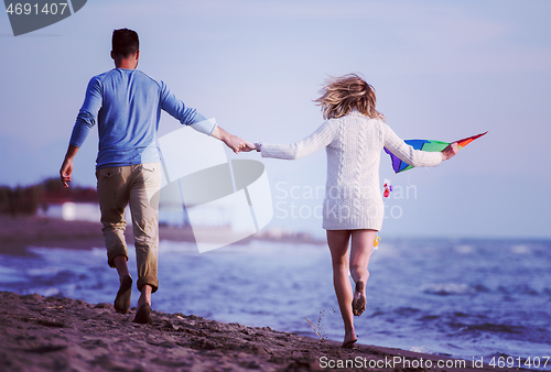 Image of Couple enjoying time together at beach