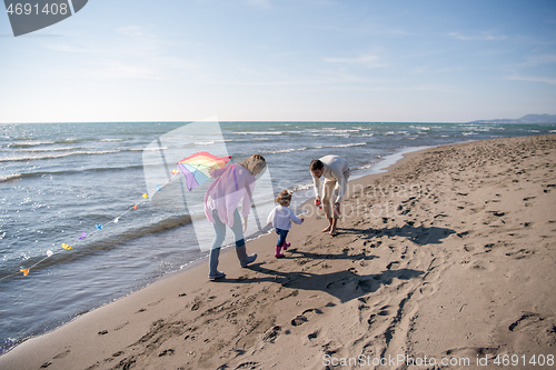 Image of happy family enjoying vecation during autumn day