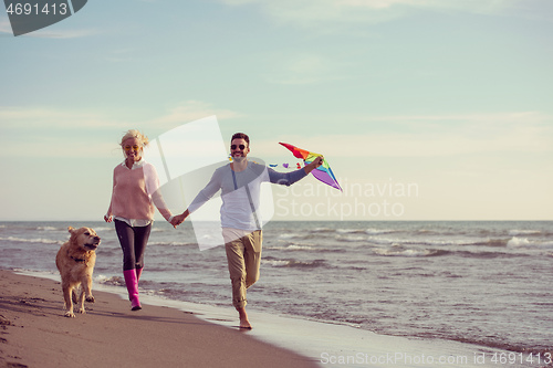 Image of happy couple enjoying time together at beach