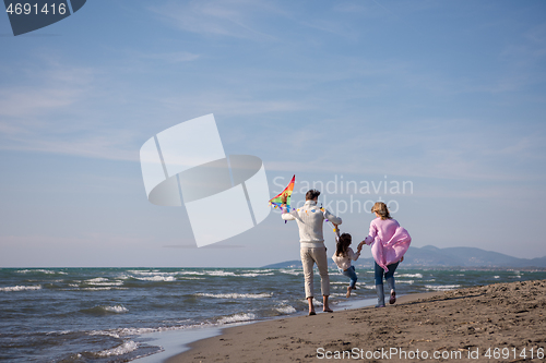 Image of happy family enjoying vecation during autumn day