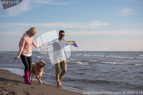 Image of happy couple enjoying time together at beach