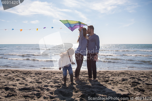 Image of happy family enjoying vecation during autumn day