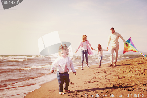 Image of happy family enjoying vecation during autumn day