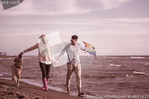 Image of happy couple enjoying time together at beach