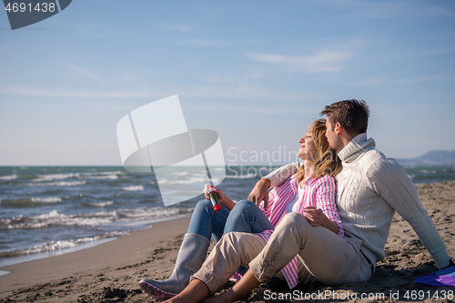 Image of young couple enjoying time together at beach