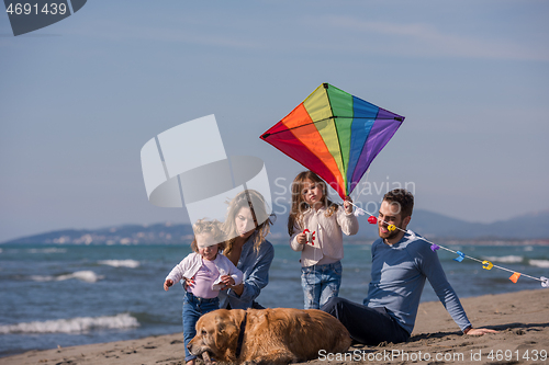 Image of happy young family enjoying vecation during autumn day