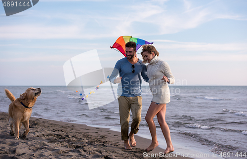 Image of happy couple enjoying time together at beach