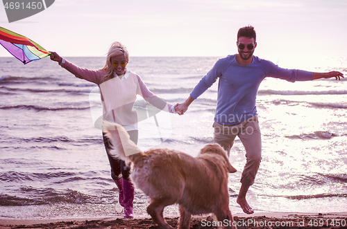 Image of happy couple enjoying time together at beach