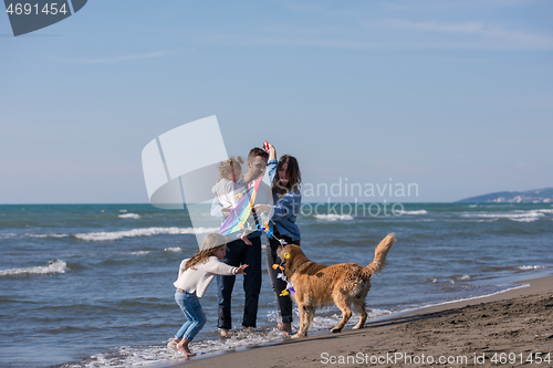 Image of happy young family enjoying vecation during autumn day