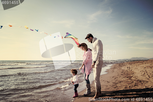 Image of happy family enjoying vecation during autumn day