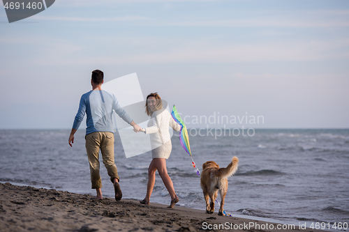 Image of happy couple enjoying time together at beach