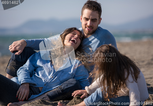 Image of Young family enjoying vecation during autumn