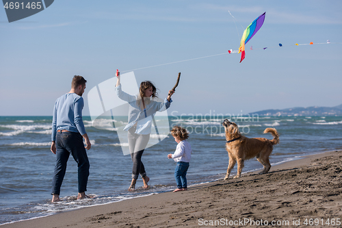 Image of happy young family enjoying vecation during autumn day