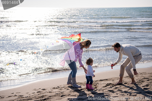 Image of happy family enjoying vecation during autumn day