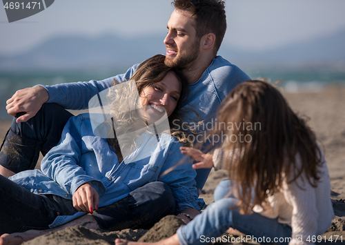 Image of Young family enjoying vecation during autumn