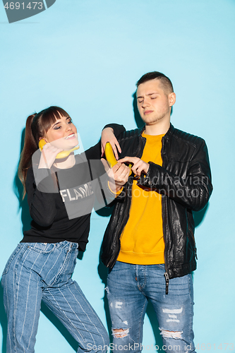 Image of Close up fashion portrait of two young pretty hipster teens