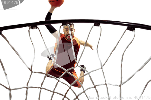 Image of Full length portrait of a basketball player with ball