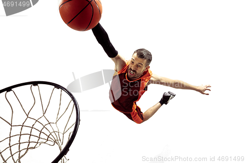 Image of Full length portrait of a basketball player with ball