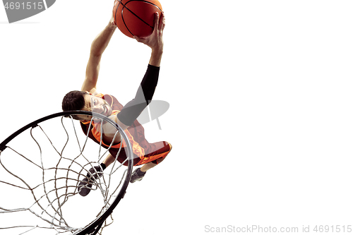 Image of Full length portrait of a basketball player with ball