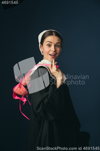 Image of Medieval young woman as a nun with bra