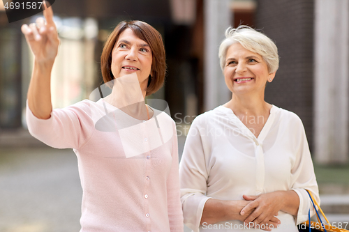 Image of senior women with shopping bags in tallinn city