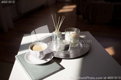 Image of coffee, candles and aroma reed diffuser on table