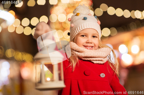 Image of happy little girl at christmas with lantern market