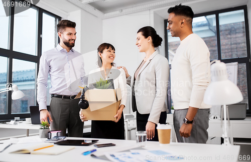 Image of new female employee meeting colleagues at office