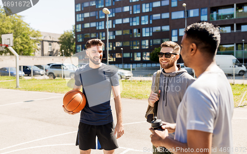 Image of group of male friends going to play basketball