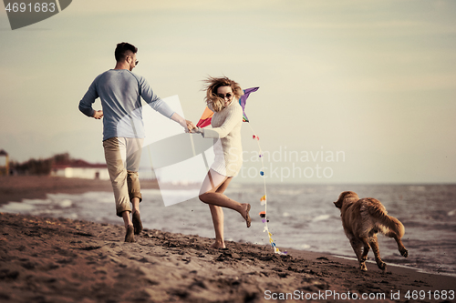 Image of happy couple enjoying time together at beach